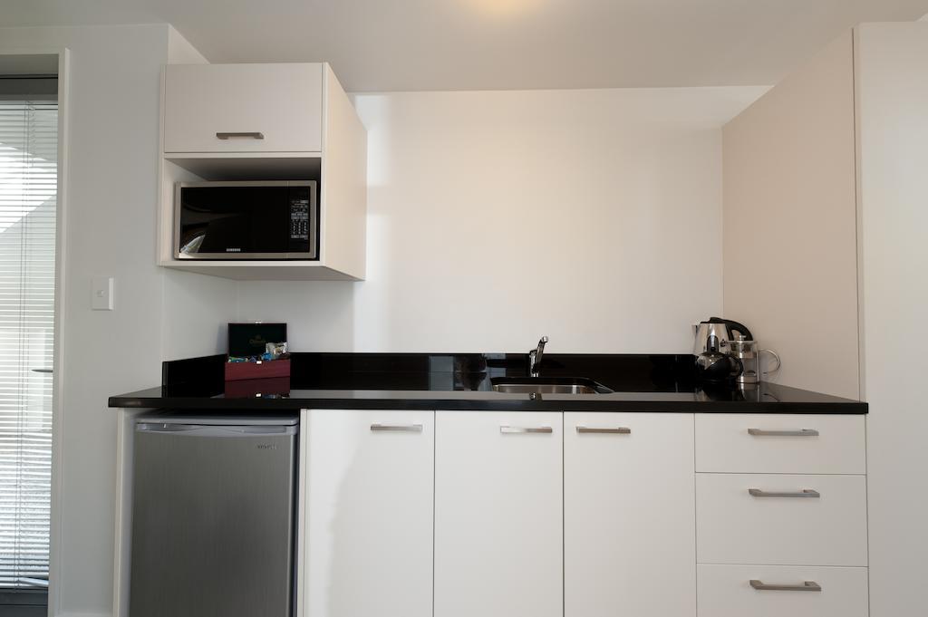 Bellano Motel Suites Christchurch Værelse billede A kitchenette in a hotel